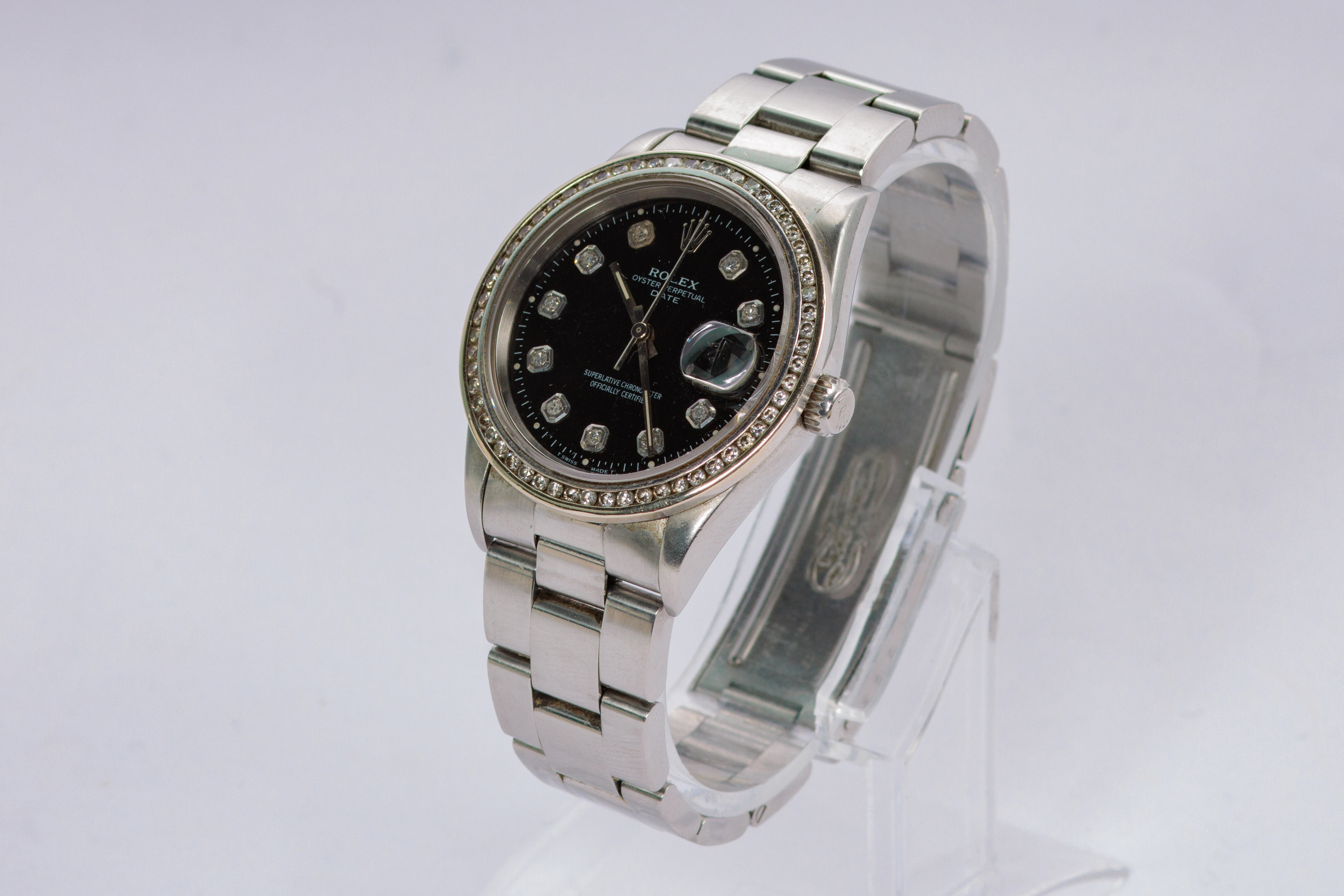 RELOJ: Marca Rolex, Date Just, automático, acero, carátula negra con 10 diamantes de… (lote 04)